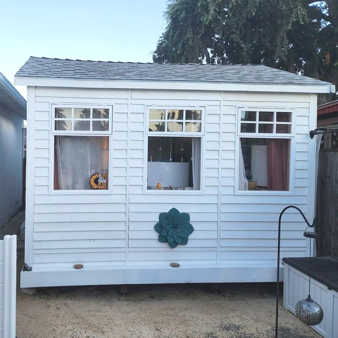 painted white cedarshed she shed with windows
